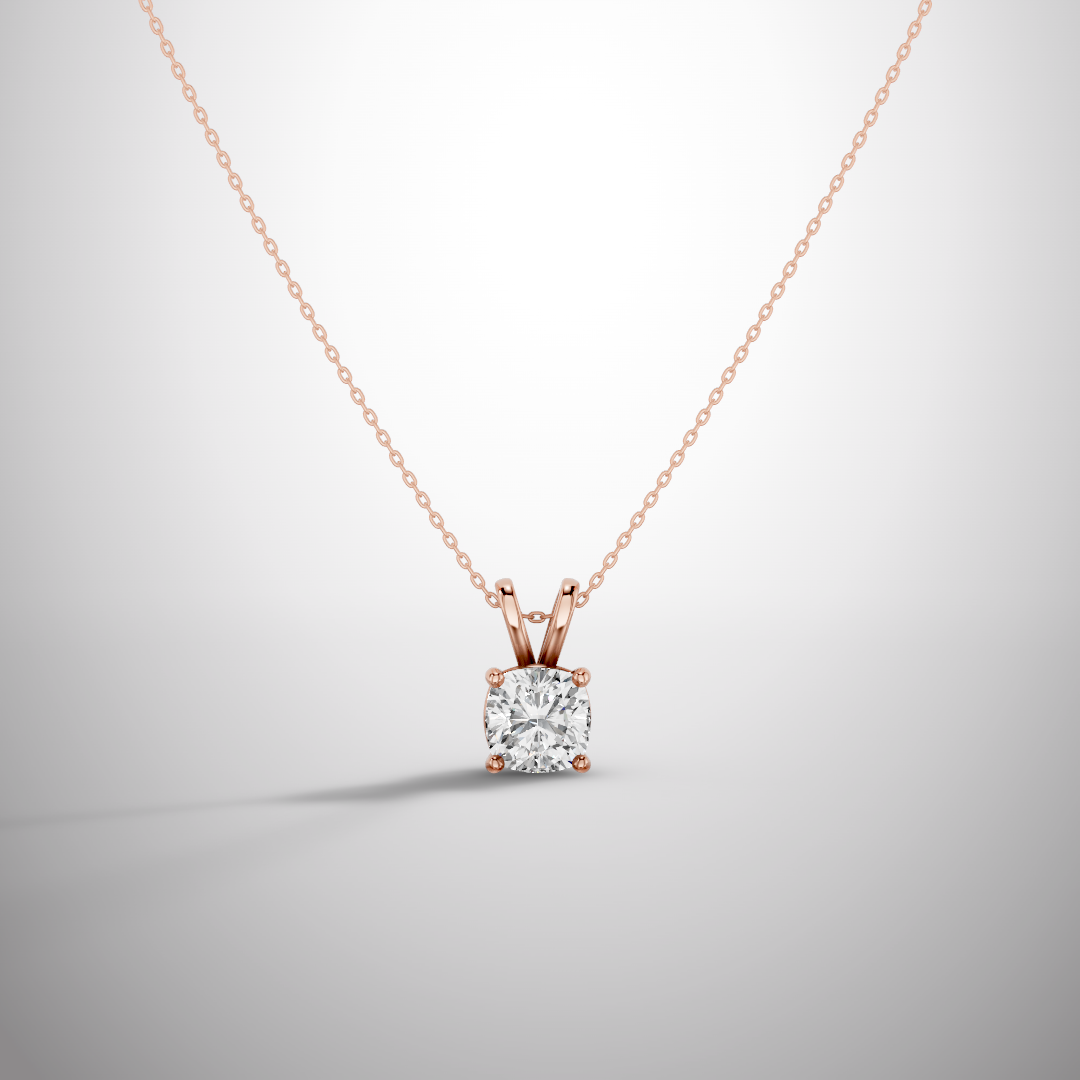 Close-up of 1 carat cushion cut moissanite pendant in sterling silver prong setting