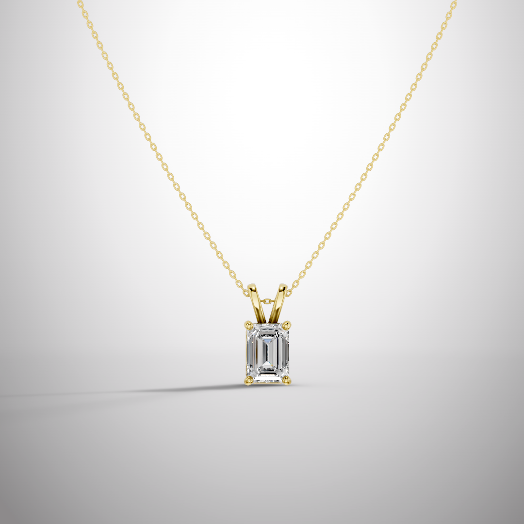 Close-up of 1 carat emerald cut moissanite pendant in sterling silver prong setting