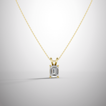 Close-up of 1 carat emerald cut moissanite pendant in sterling silver prong setting