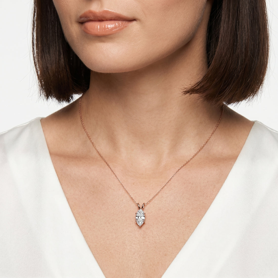 Close-up of 1 carat marquise cut moissanite pendant in sterling silver prong setting