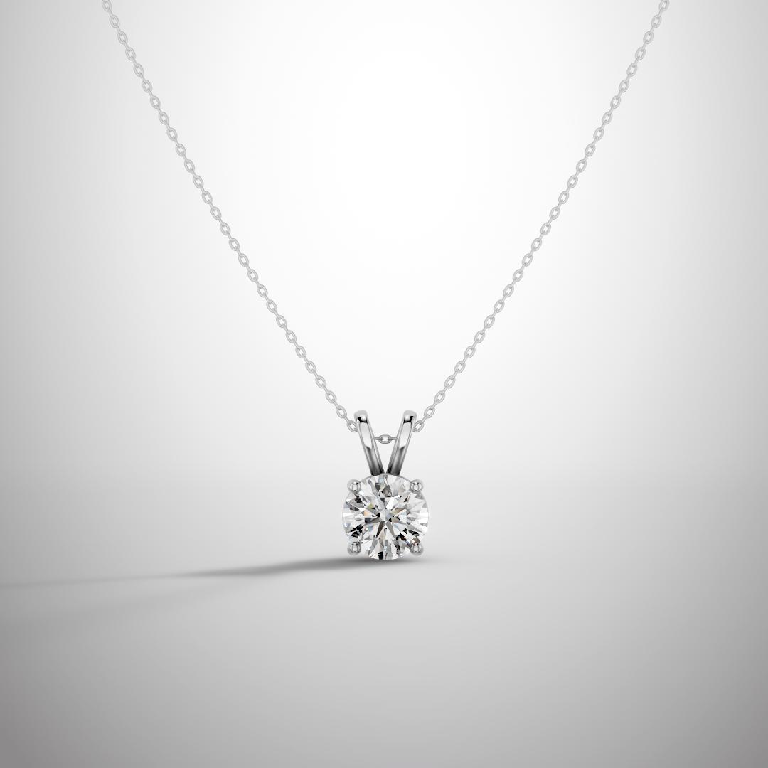 Close-up of 1 carat round cut moissanite pendant in sterling silver prong setting