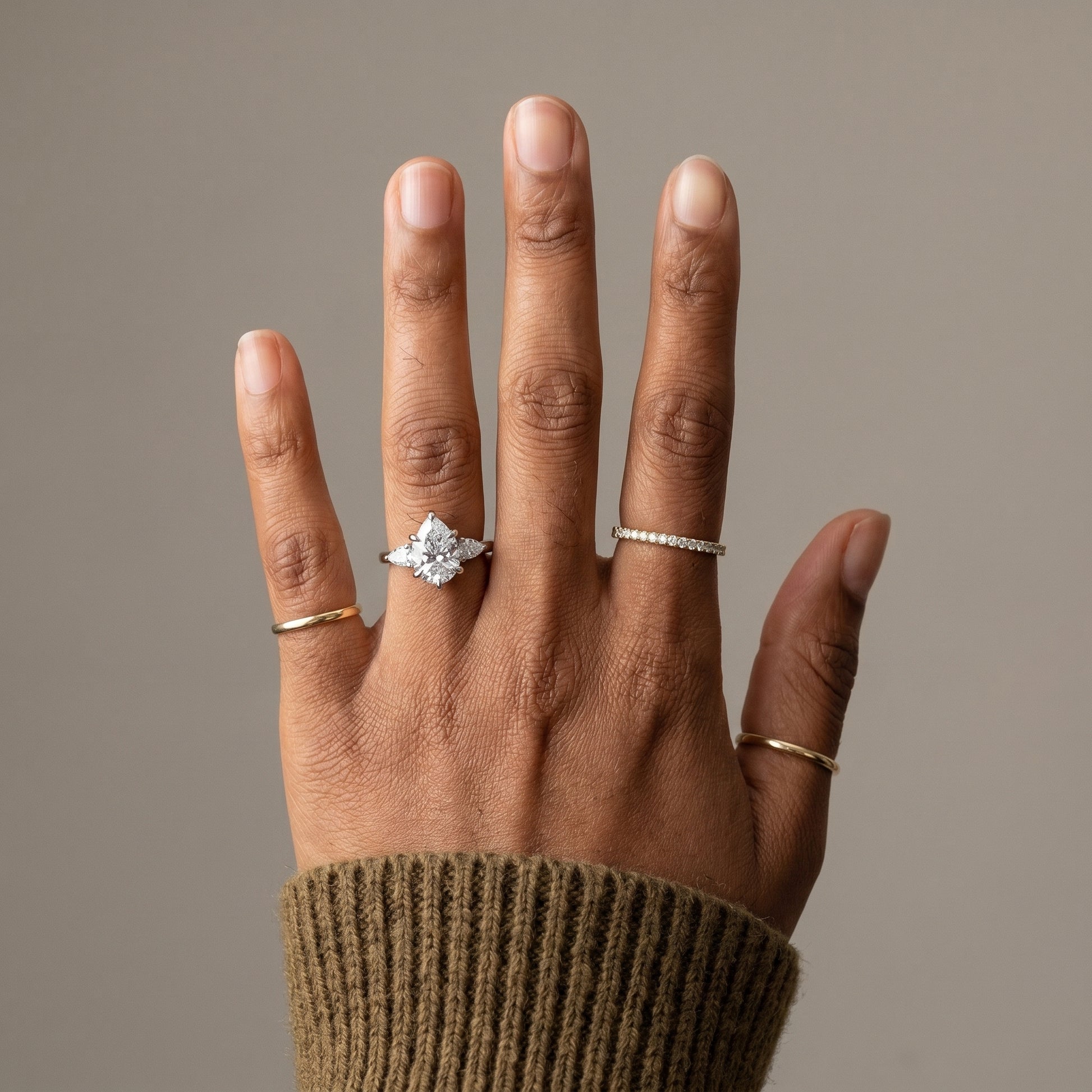 2 carat Pear moissanite ring on finger 925 sterling silver engagement ring