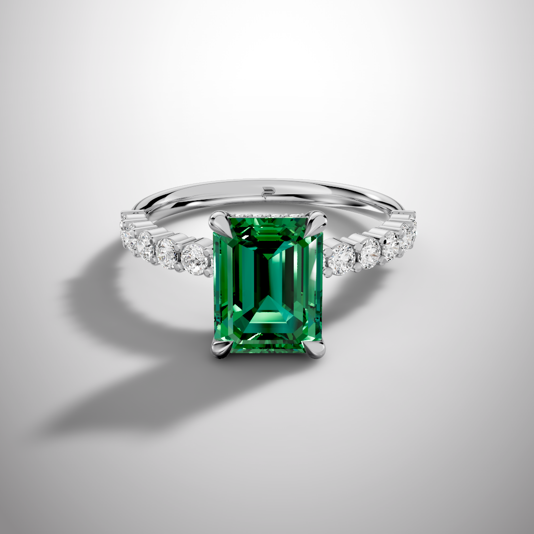 Emerald cut green moissanite ring with pavé band in 925 sterling silver front view
