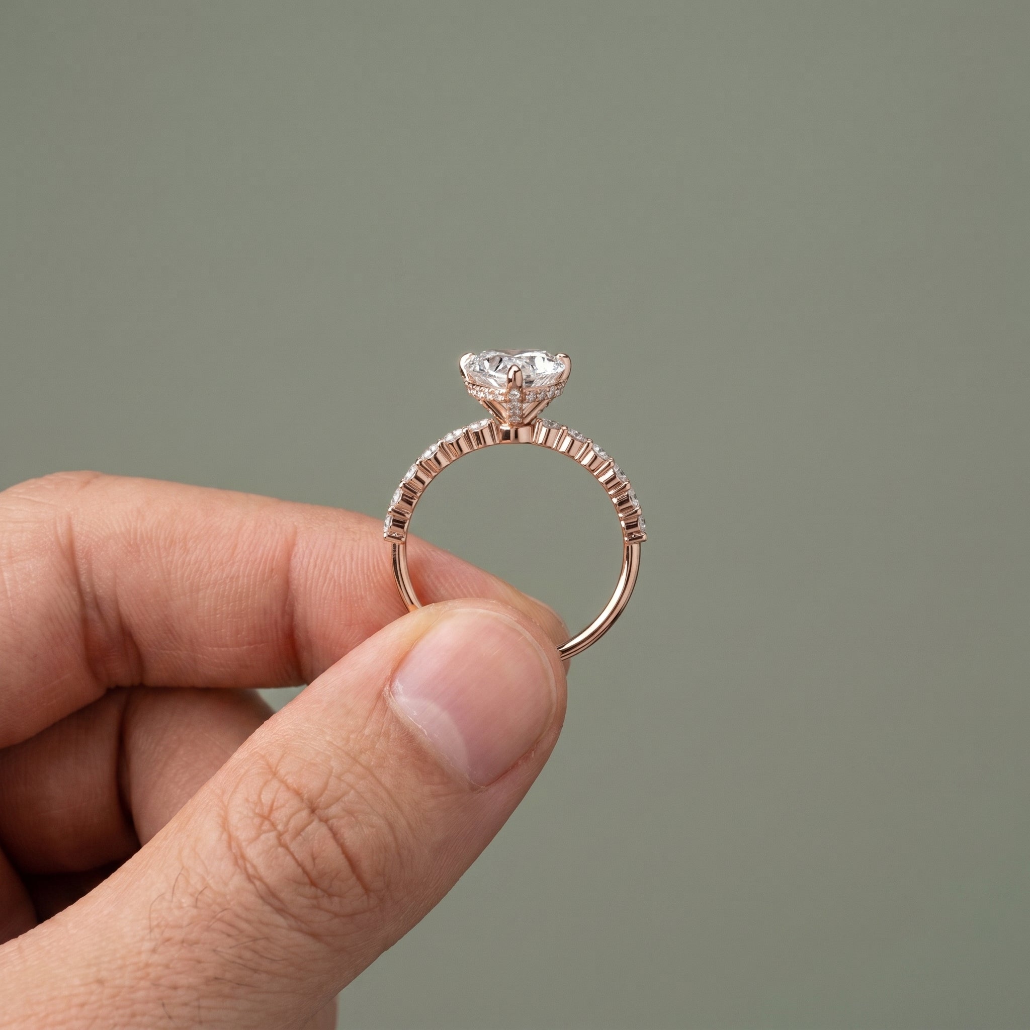 Elegant heart cut moissanite engagement ring with pavé band in silver
