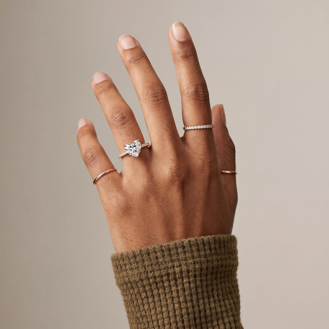 Heart cut moissanite solitaire ring with pavé band in 925 sterling silver front view
