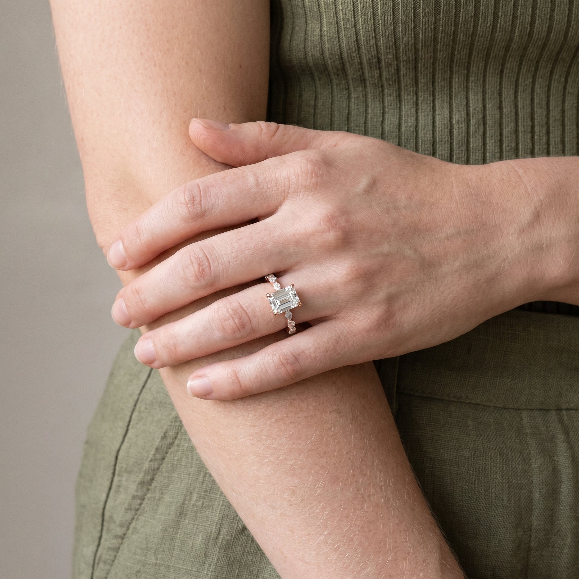 Luxury emerald cut moissanite solitaire ring with side stones and hidden halo