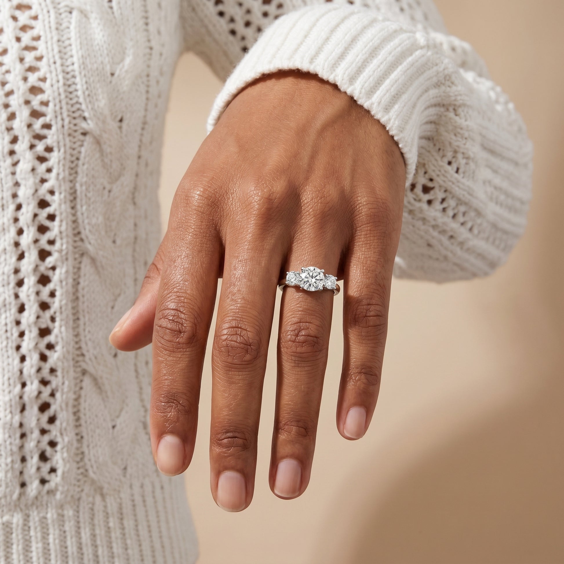 luxury silver moissanite engagement ring 3 stone design wedding jewelry elegant female lifestyle shot