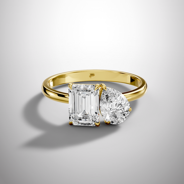Luxury Toi et Moi moissanite ring with emerald and round cut stones
