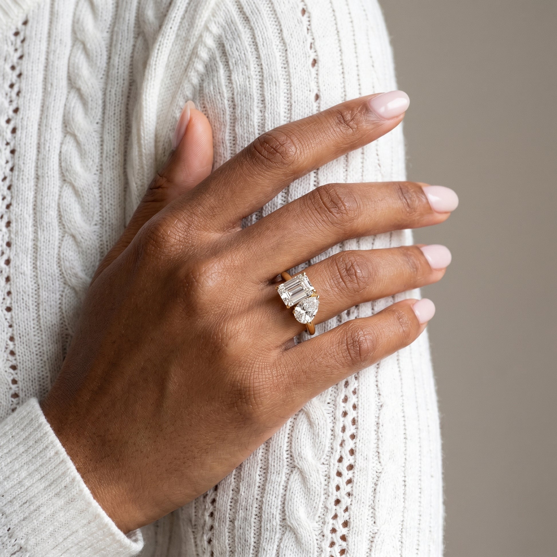 Elegant two stone moissanite engagement ring worn on hand