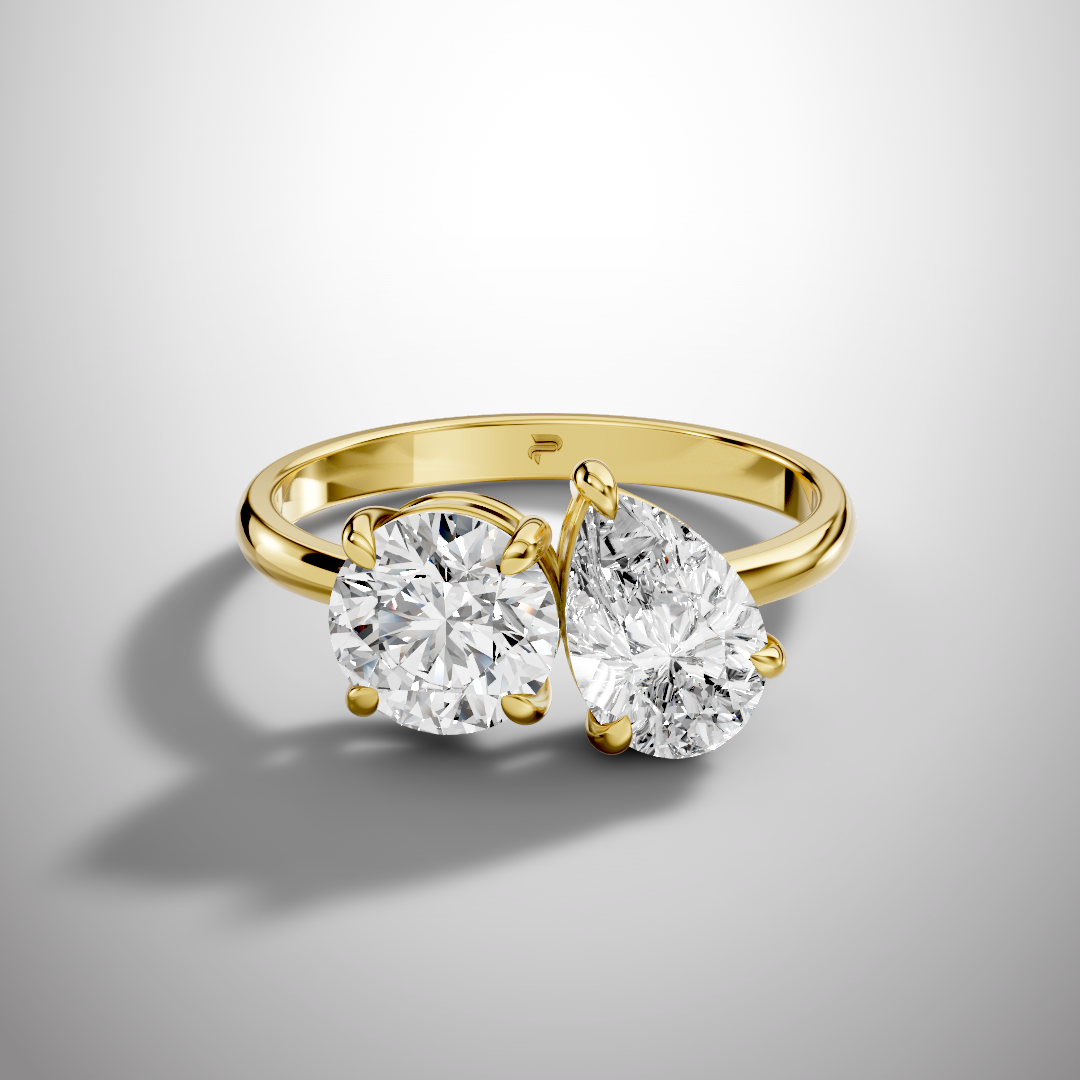 Luxury Toi et Moi moissanite ring with round and pear cut stones in sterling silver