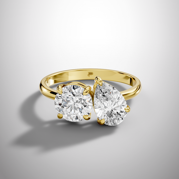 Luxury Toi et Moi moissanite ring with round and pear cut stones in sterling silver
