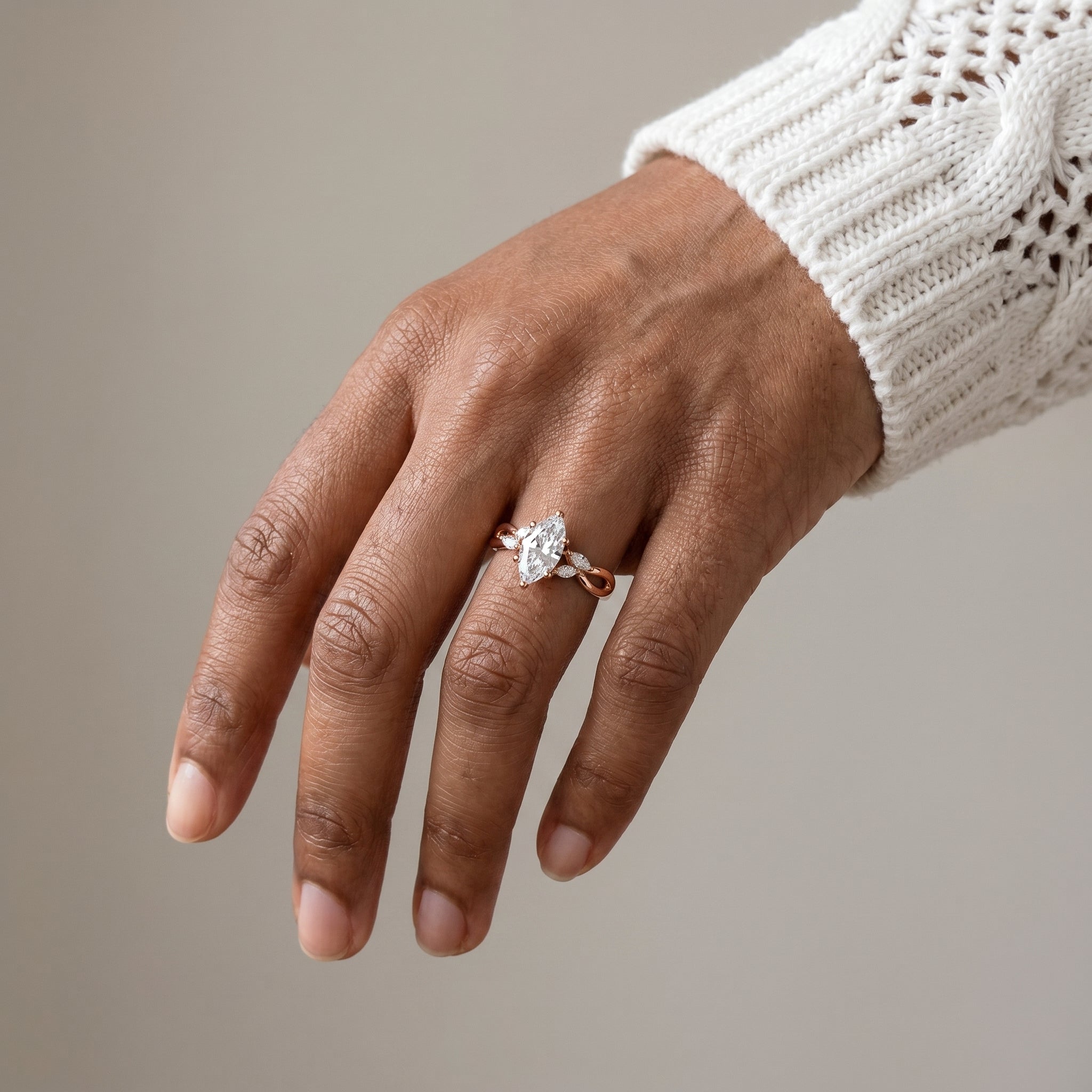marquise cut moissanite infinity ring worn on hand 925 silver close up