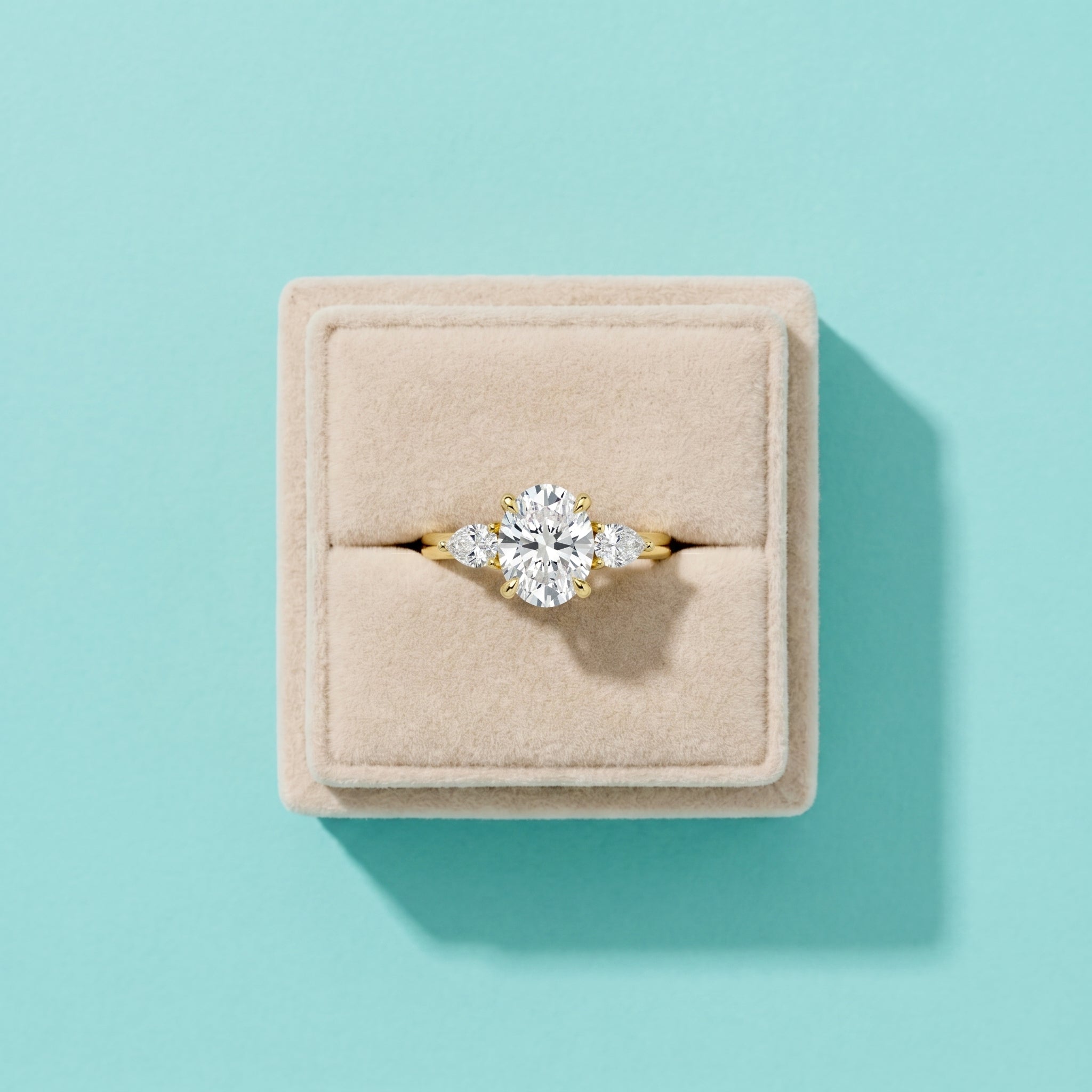 Three-Stone Oval Moissanite Engagement Ring with Pear Side Stones in 925 Sterling Silver