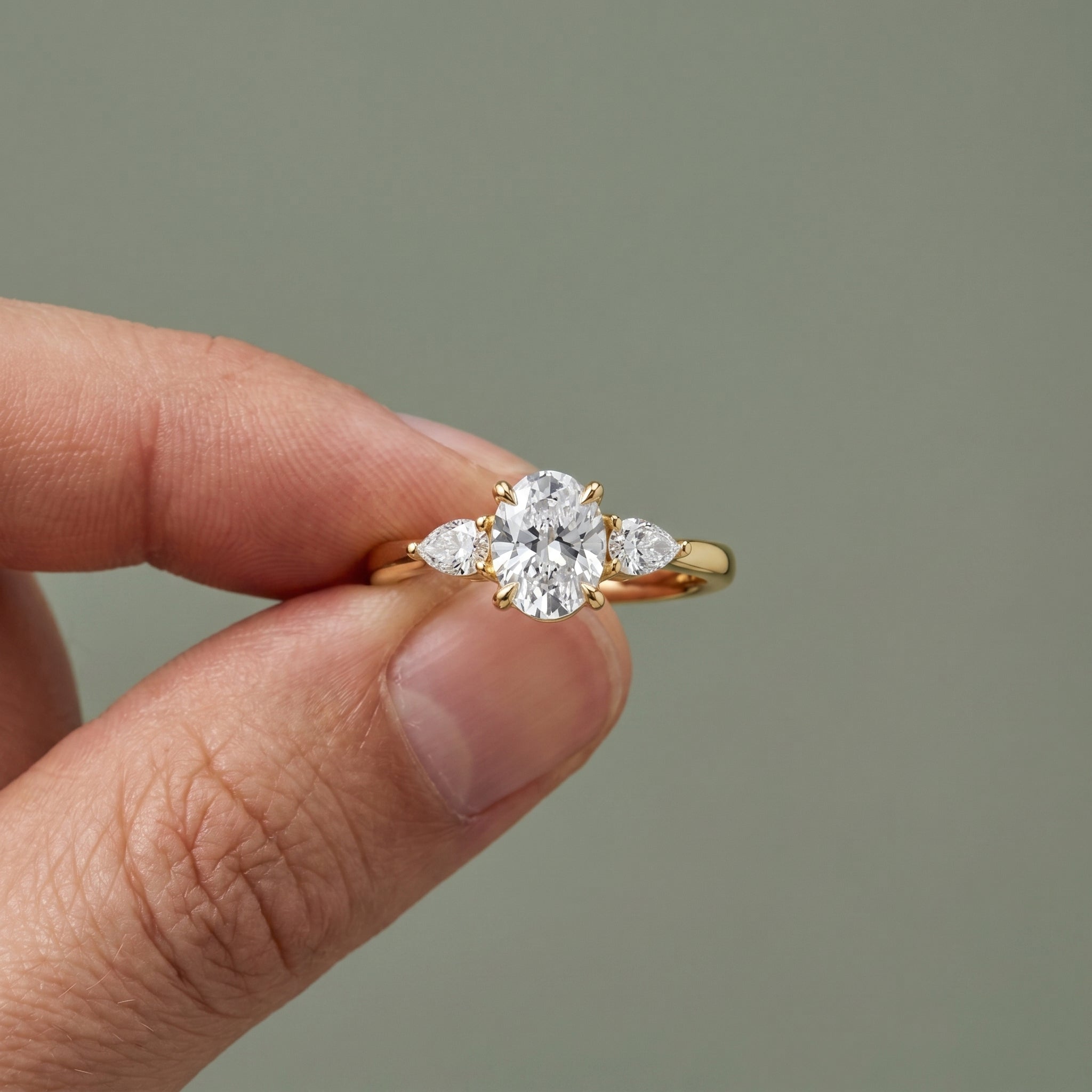 Three-Stone Oval Moissanite Engagement Ring with Pear Side Stones in 925 Sterling Silver
