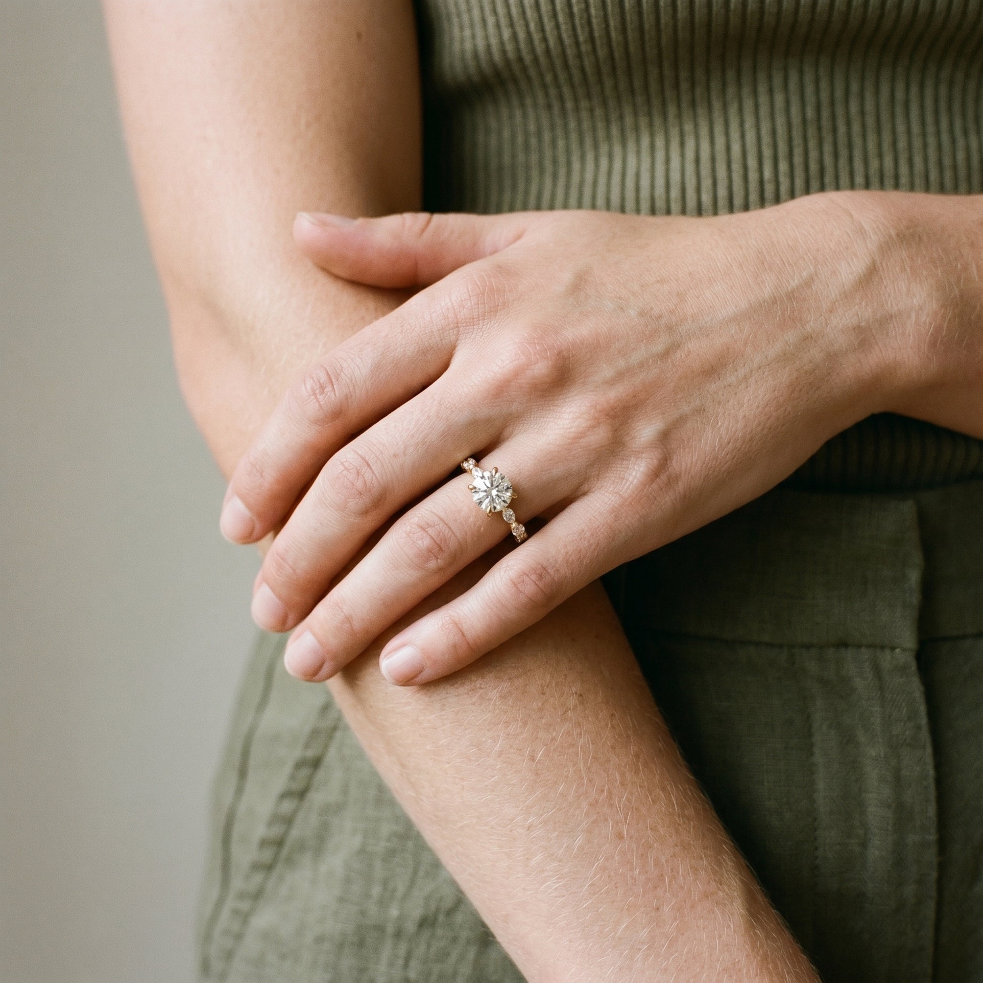 Romantic moissanite engagement ring with hidden halo in yellow gold setting
