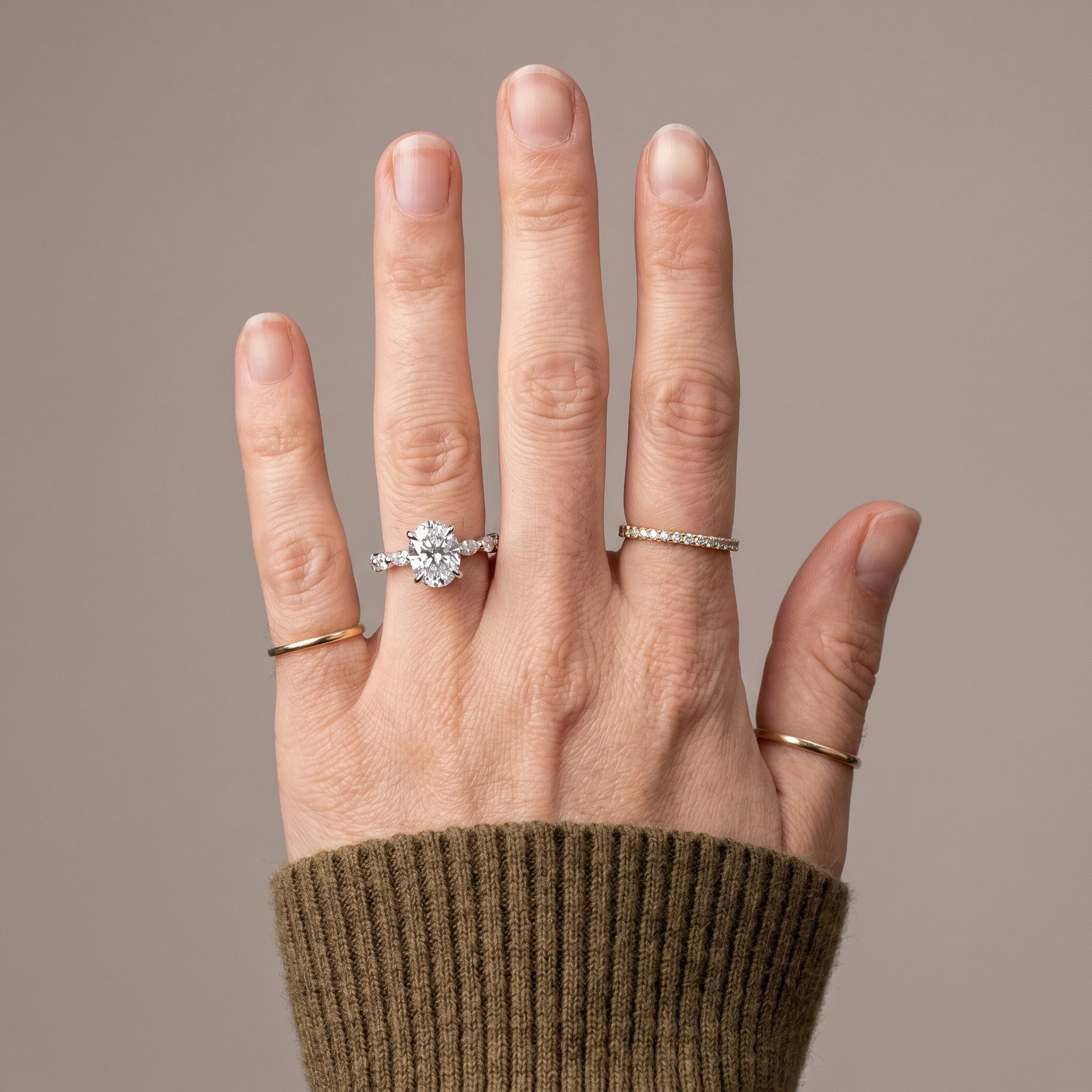 925 sterling silver moissanite solitaire ring worn on hand with hidden halo detail
