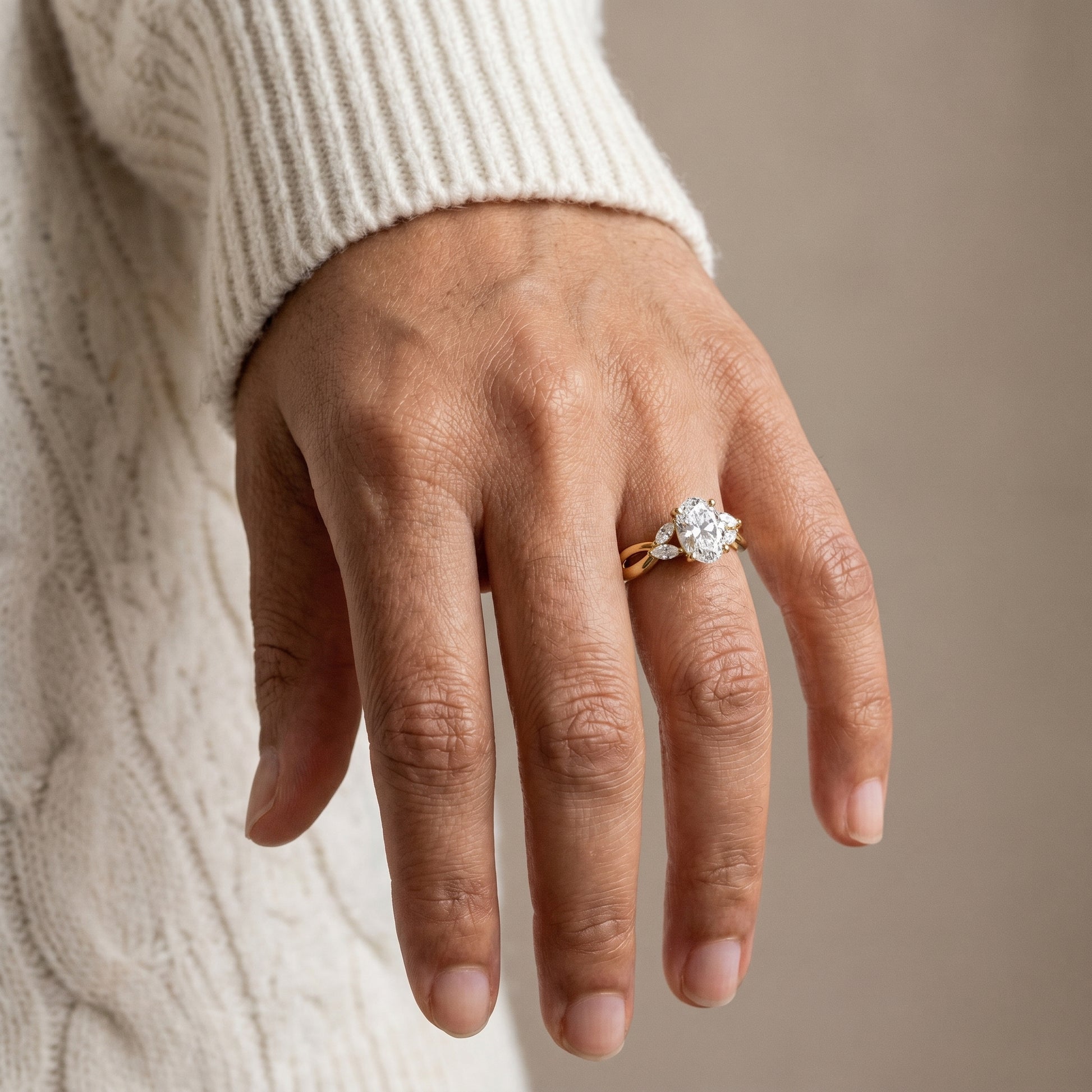 close up oval cut moissanite infinity ring on finger 925 silver