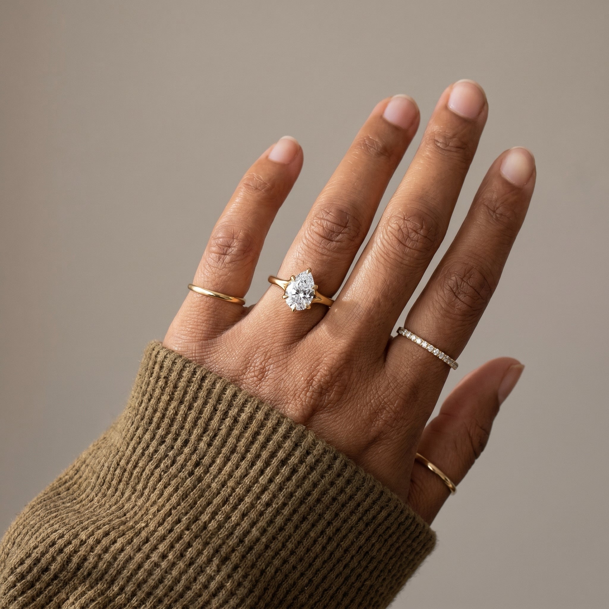 Luxury pear cut moissanite ring for proposal in yellow gold
