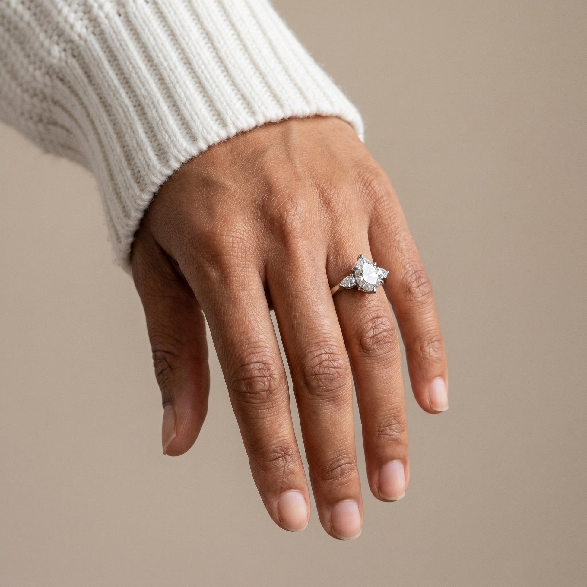 Pear cut moissanite three stone ring 925 silver close up sparkle detail