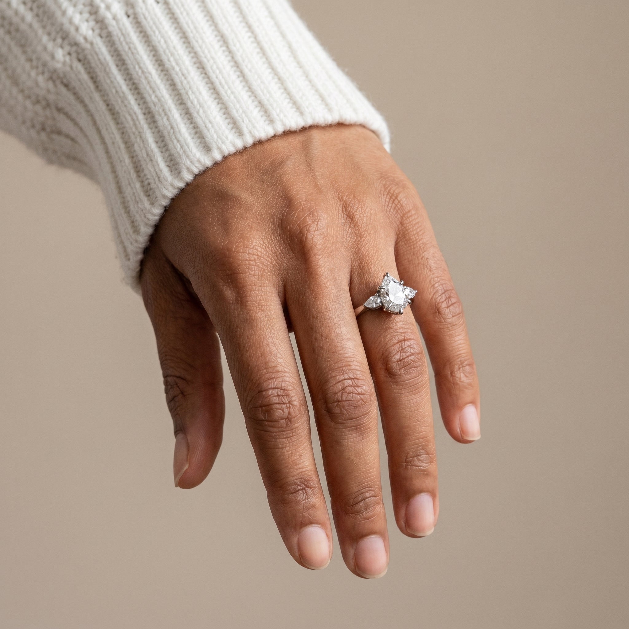 Pear cut moissanite three stone ring 925 silver close up sparkle detail