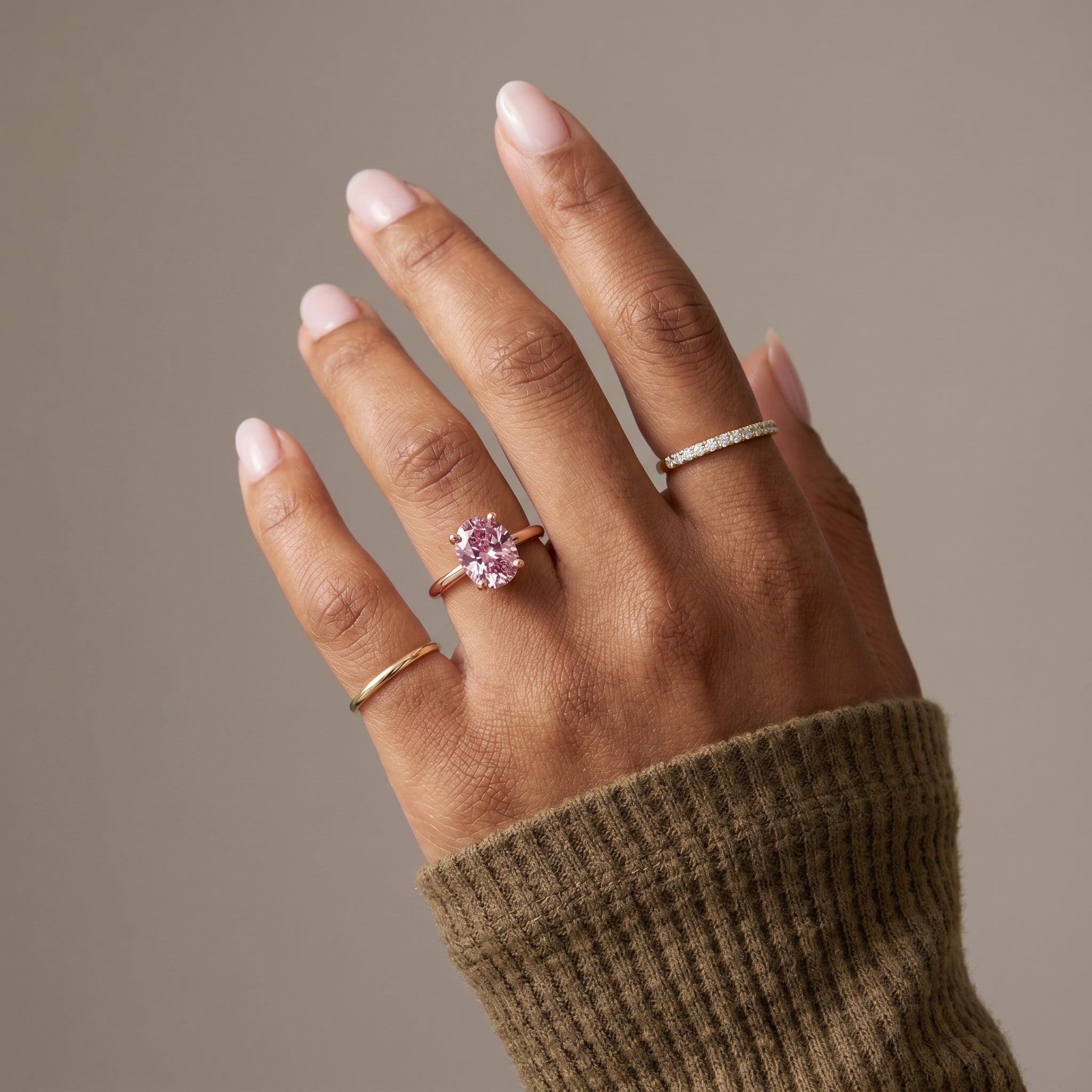 Close up pink cushion moissanite ring yellow gold solitaire fine jewelry detail