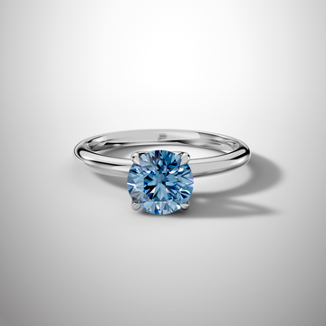 Blue moissanite engagement ring round cut in sterling silver