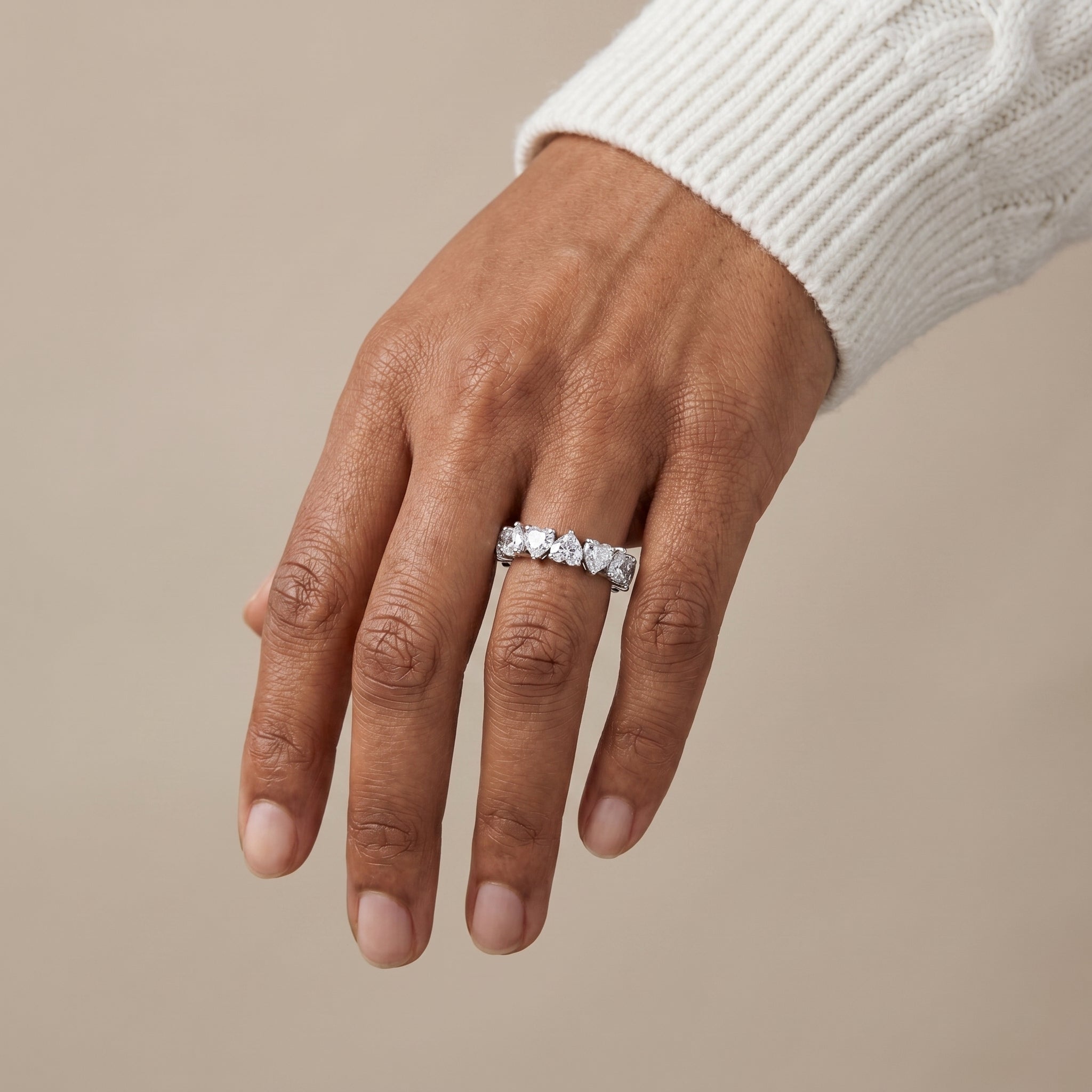 luxury silver heart moissanite eternity ring worn by model elegant romantic jewelry look