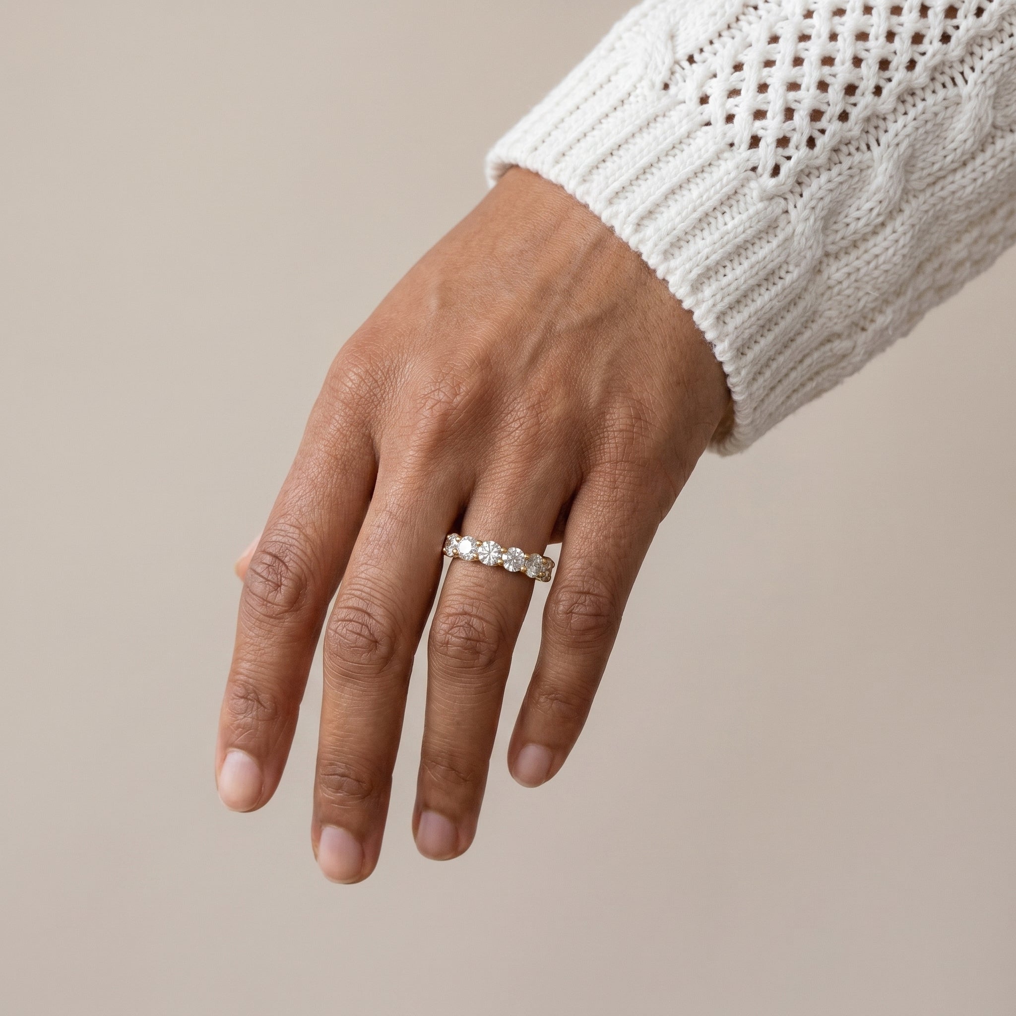 luxury silver moissanite eternity ring worn by model elegant stylish jewelry look