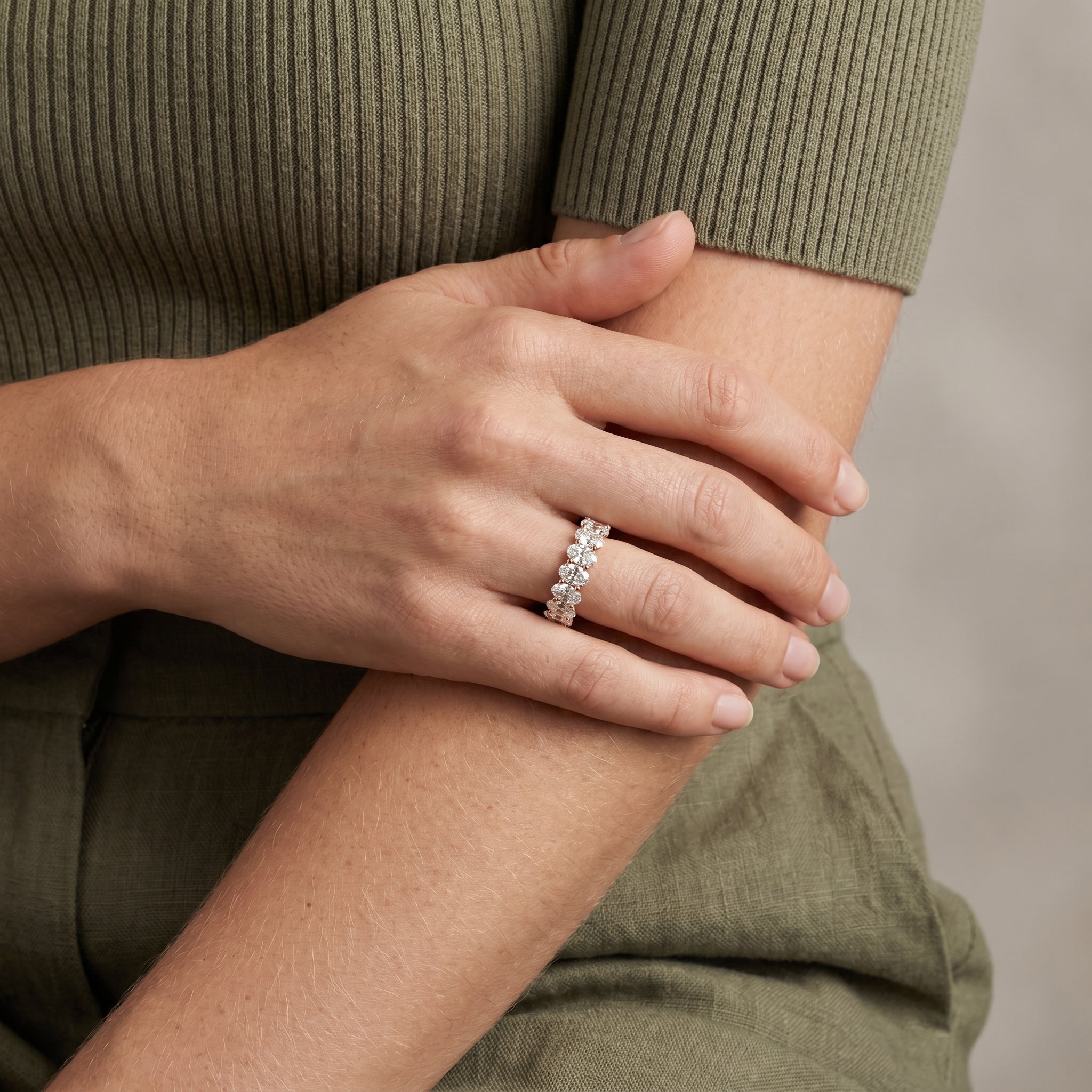 luxury silver oval moissanite eternity ring worn by model elegant stylish jewelry look