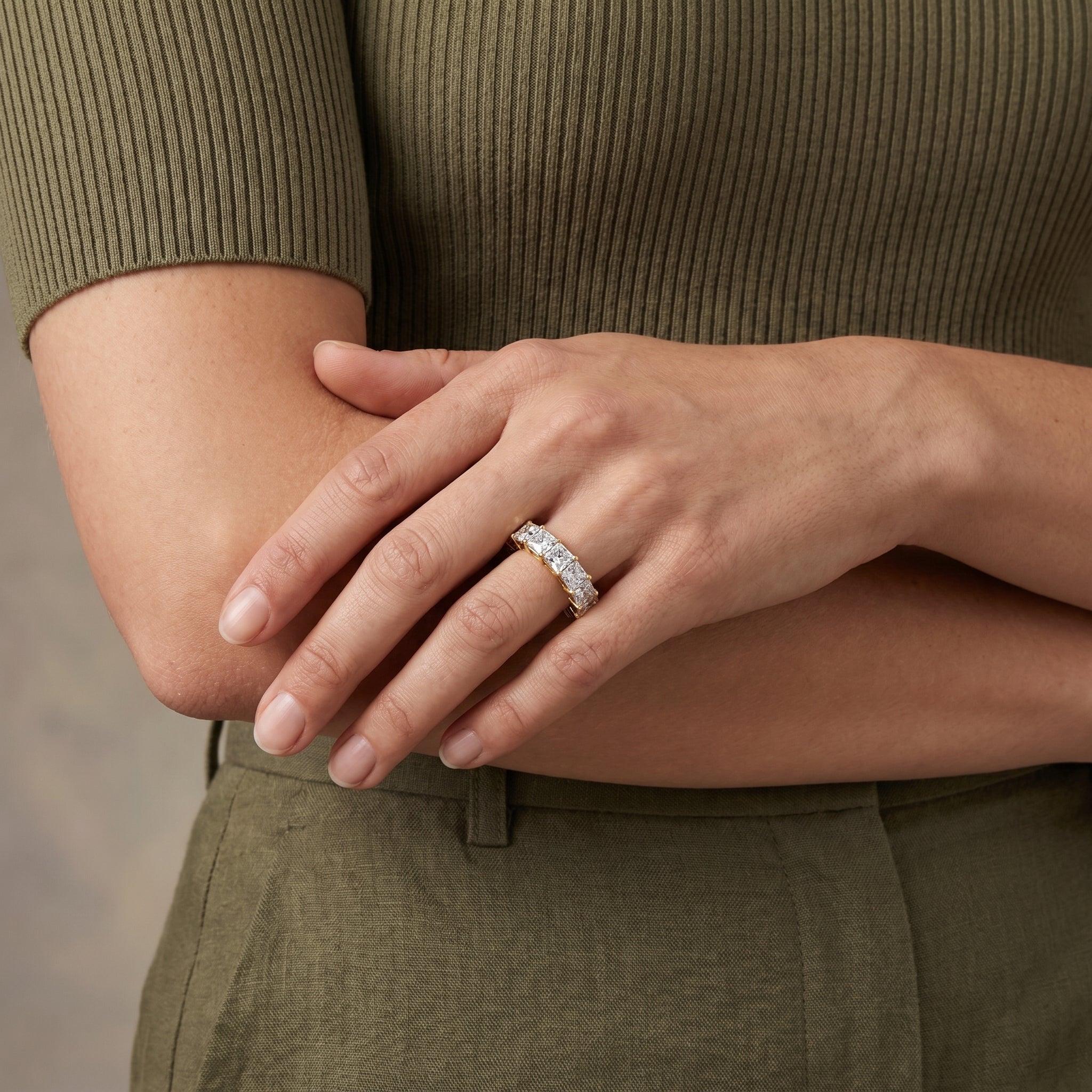 luxury silver princess moissanite eternity ring worn by model stylish elegant jewelry
